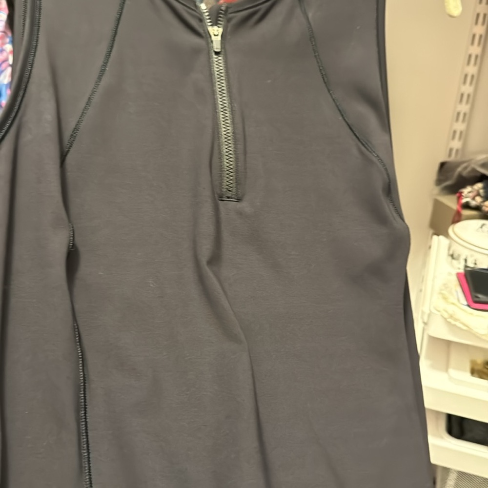 Black sweat proof Athleta sleeveless dress. Runs SMALL. Nice fit a fun function.